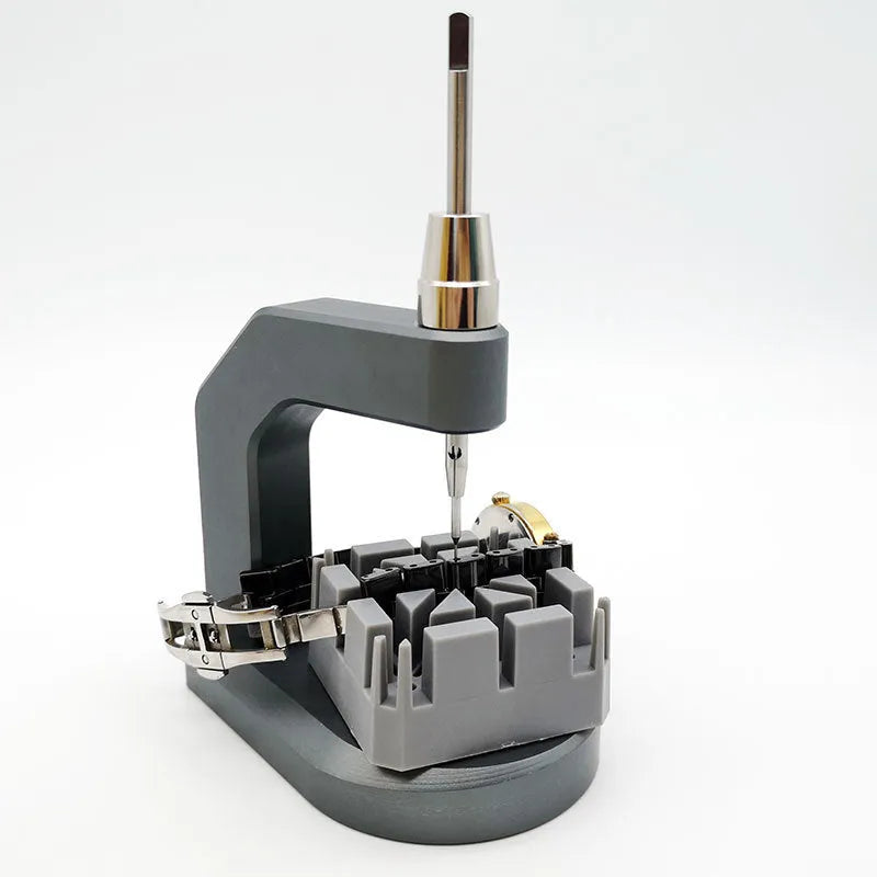 Silver multi-purpose press strap removal tool made from tool steel.