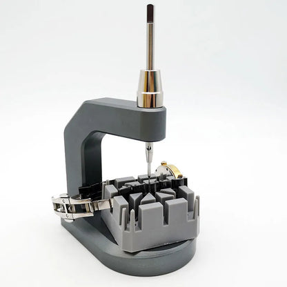 Silver multi-purpose press strap removal tool made from tool steel.