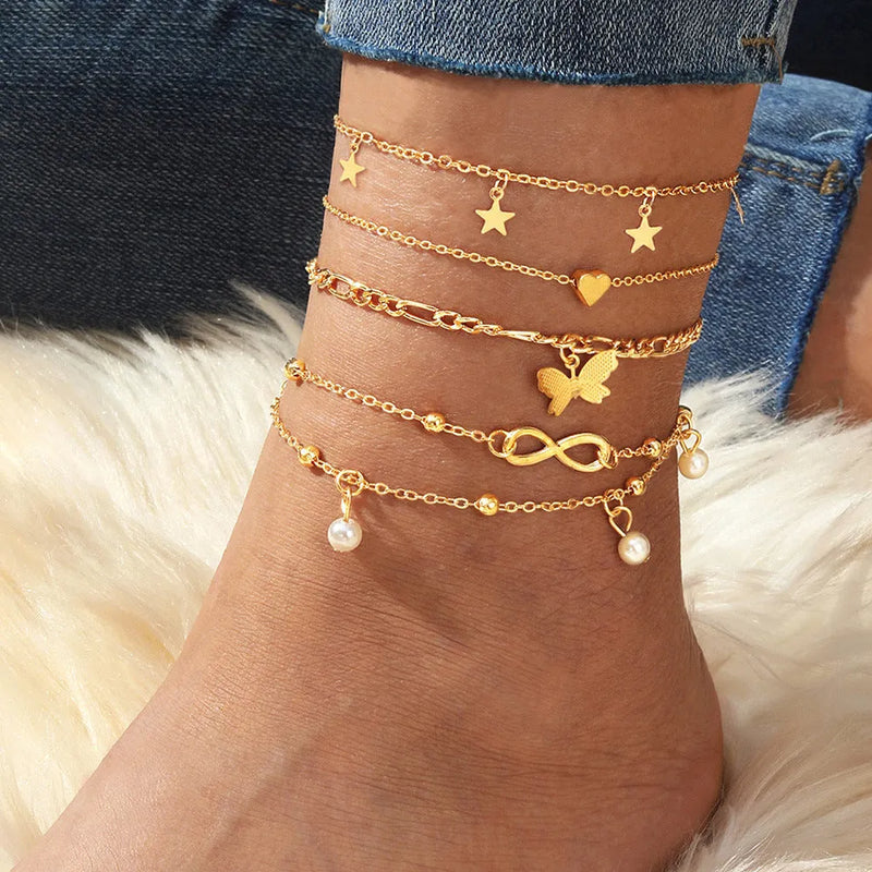 Women's butterfly pearl heart anklet 4-piece set made from alloy metal with simple style design and adjustable chain length for versatile layered jewellery looks, ideal for casual wear and gifting occasions in feminine accessories collection.