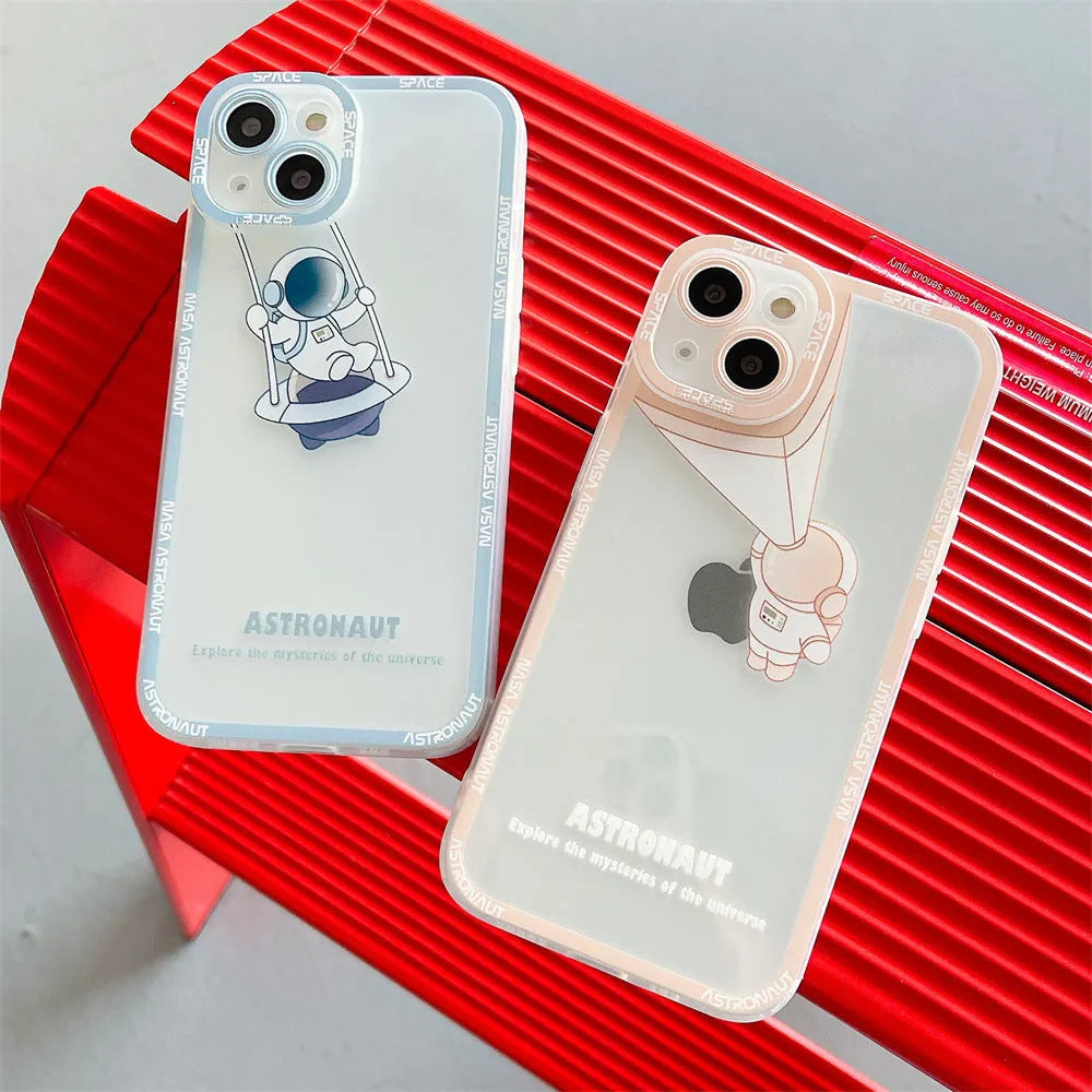 Transparent silicone iPhone case with blue astronaut print, shown on a phone.