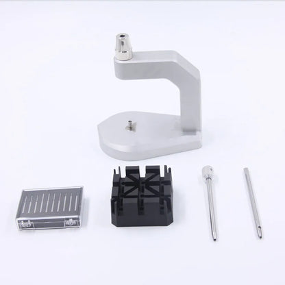 Silver multi-purpose press strap removal tool made from tool steel.