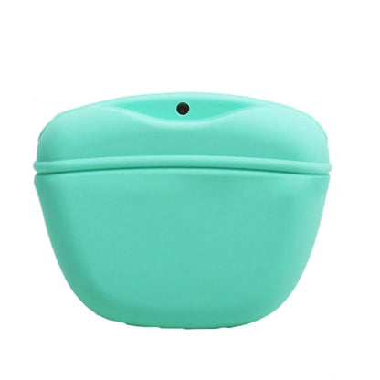 Black silicone dog training treat pouch with clip and magnetic closure shown attached to a belt.