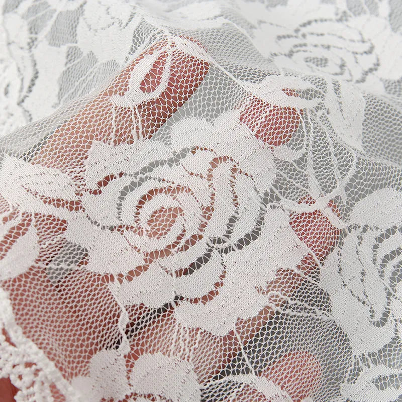 Round lace bridal head covering with floral embroidery measuring 30cm in black and white colours