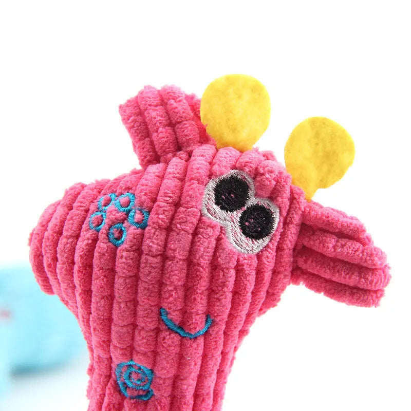 Blue deer-shaped plush dog toy with corn grain texture showing sound module inside