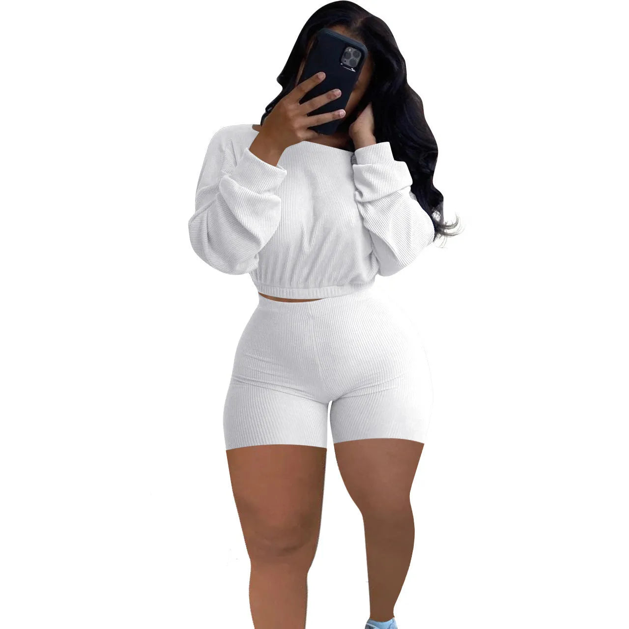 Women's long sleeve off-the-shoulder top and shorts two-piece set in a solid colour.