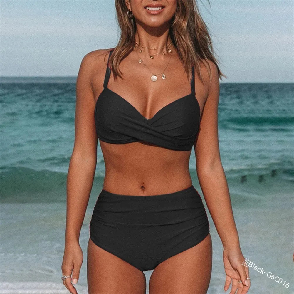 Women's solid colour cross-strap bikini in nylon fabric on a mannequin.