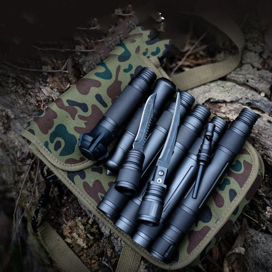 T-shaped telescoping hiking stick with compass, whistle, cutting edge, and glass breaker tip in black or gun grey finish