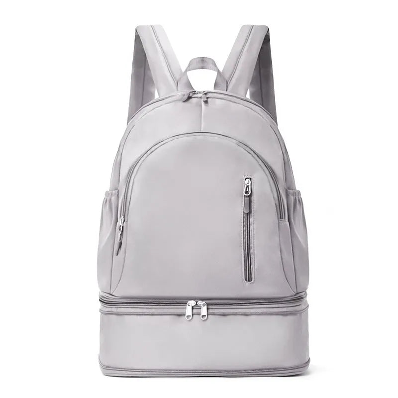 Women's casual backpack in black with adjustable curved shoulder straps and contrast stitching, 20-35L waterproof polyester.