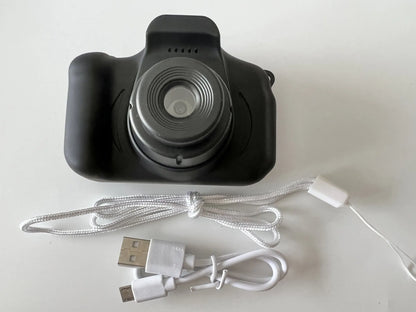 Colourful kids digital camera with silicone case showing 2-inch screen and lens.
