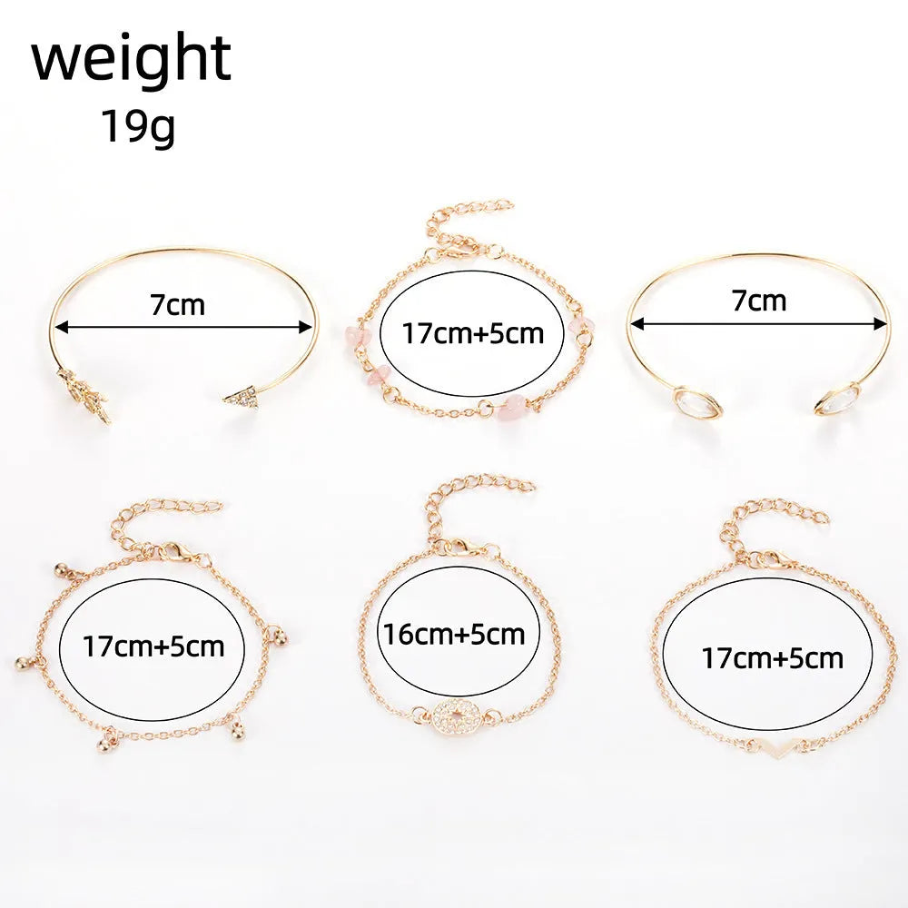 Set of six gold-colour zinc alloy bracelets with water drop, arrow, and V-shaped charms.