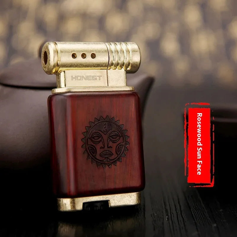 Ebony gas lighter with decorative rosewood and red wood carved panels