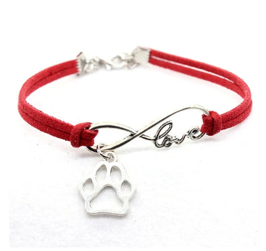 Hand-woven Infinite Love Pet Bracelet in various colors, showcasing the bow shape and alloy material.