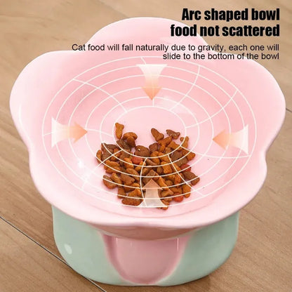 Blue ceramic raised pet bowl with floral pattern and non-slip base for cats or small dogs.