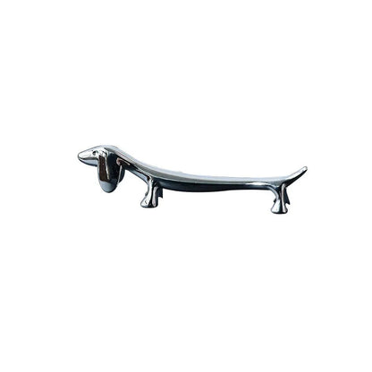 Silver sausage dog chopstick rest and cutlery holder made from zinc alloy with coating for chopsticks, knives or forks