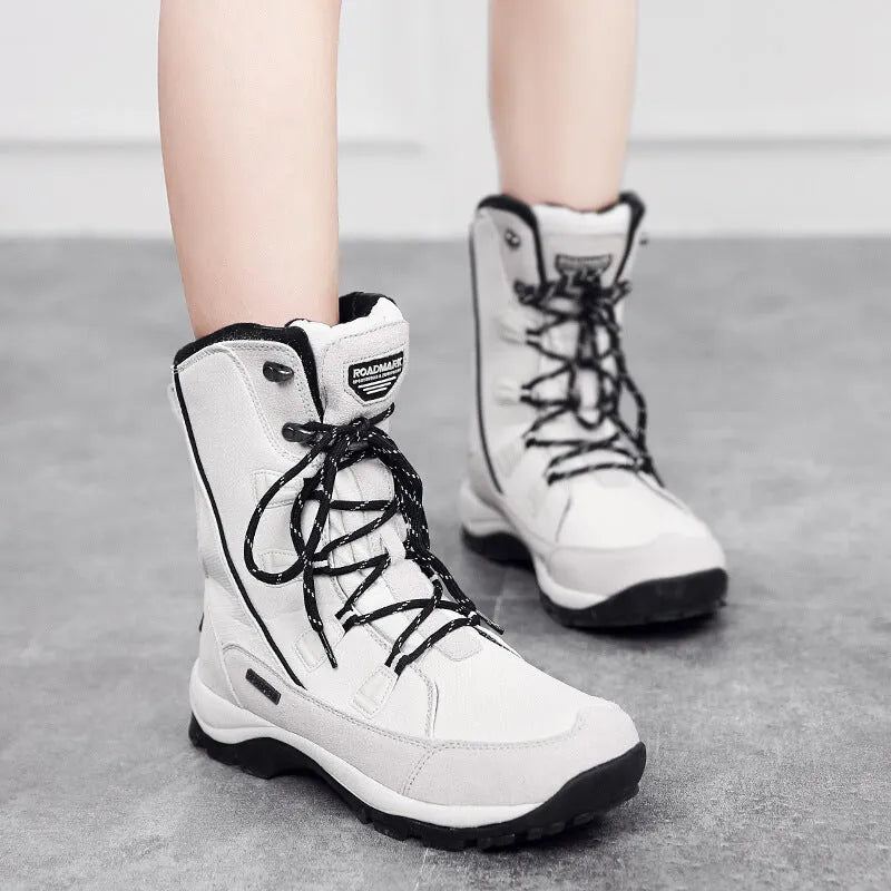 Women's mid-calf thermal snow boots in black with genuine leather upper and rubber sole for winter