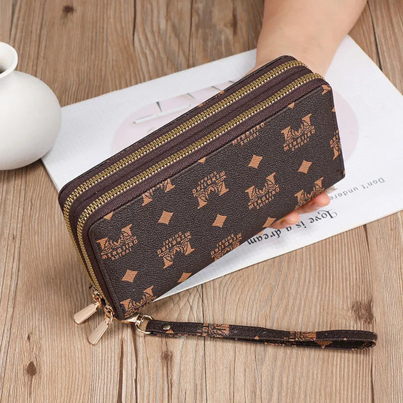 Long black retro-style PU leather wallet clutch with a printed pattern, showing a mobile phone pocket and a zippered coin purse.