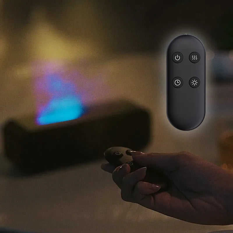 Black Flame Dynamic Aroma Diffuser with colour-changing lights and remote control on a table.