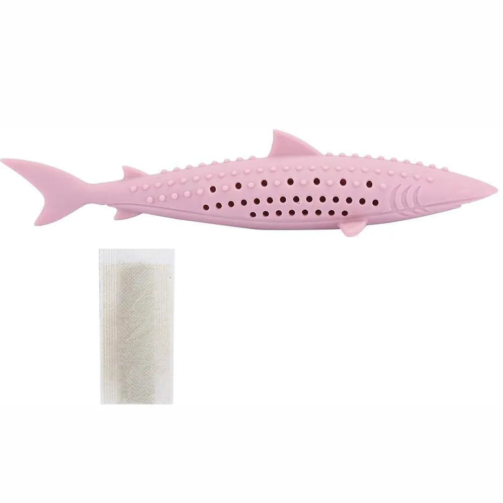 Green fish-shaped silicone cat chew toy with side holes, shown disassembled to reveal hollow interior for catnip.