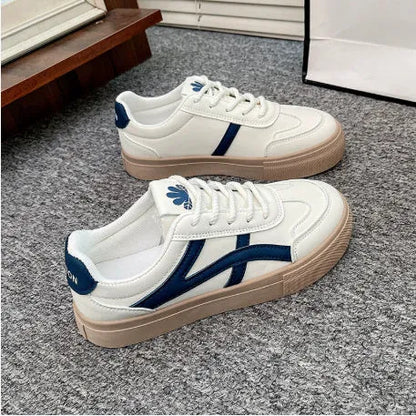 Blue and brown low-top casual sports shoes with round toe and flat rubber sole.