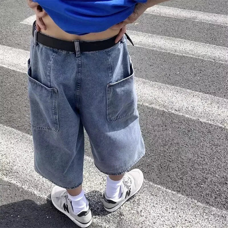 Men's blue washed denim shorts with high waist, cropped length, straight leg, and zipper fly