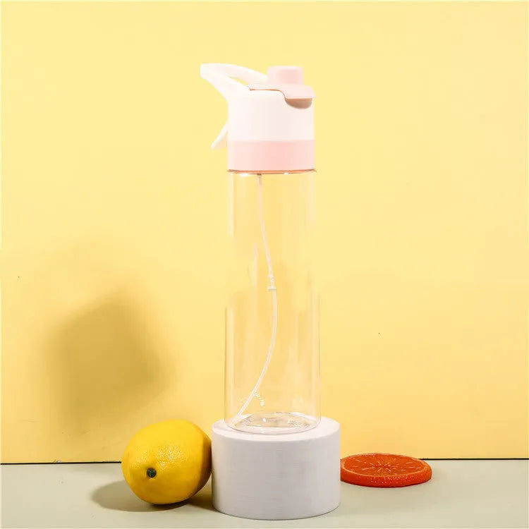 Large plastic spray water bottle with handle strap and leakproof lid in green colour.