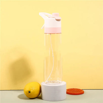 Large plastic spray water bottle with handle strap and leakproof lid in green colour.