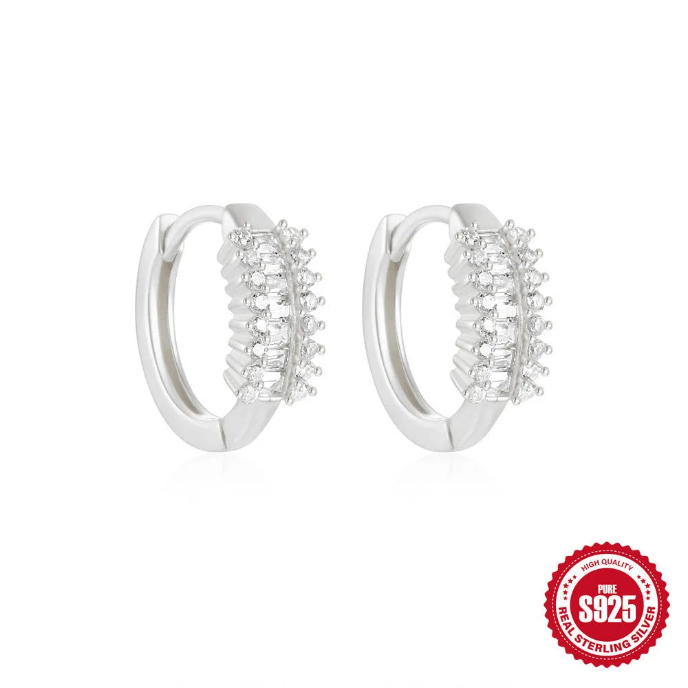 Sterling silver geometric stud earrings with small round diamond accents in gold or silver finish