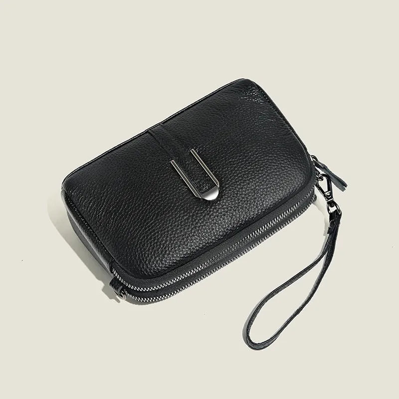 Minimalist top-grain leather crossbody bag in horizontal square shape with inner pockets, available in five colours
