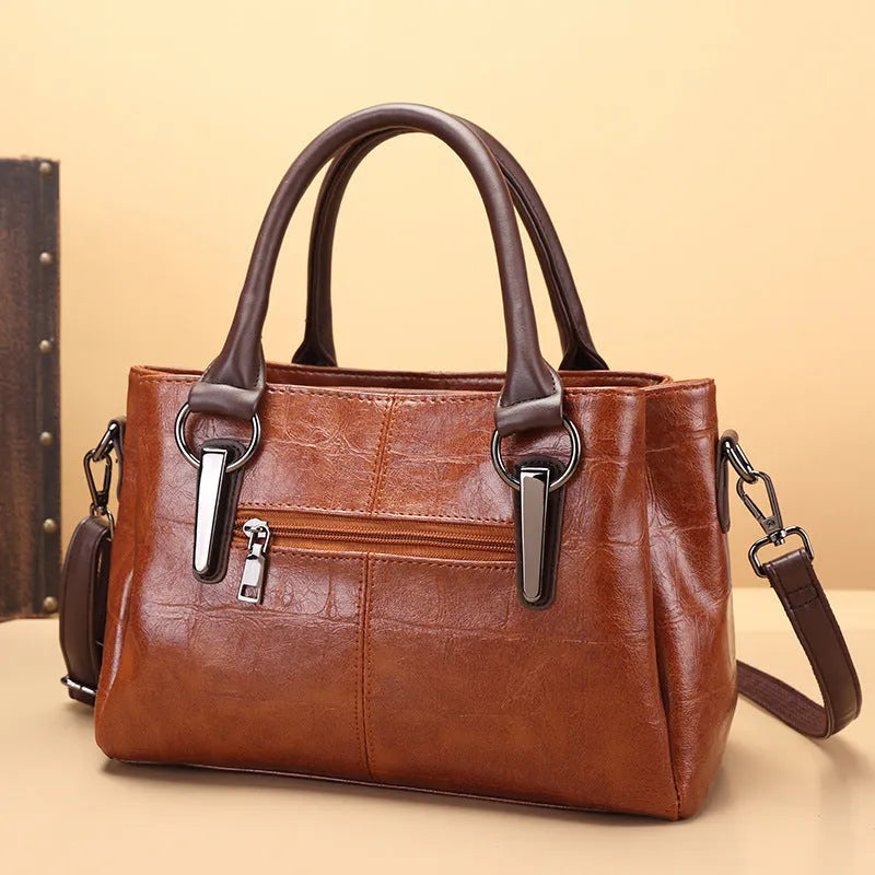 Retro contrast large capacity shoulder bag showing horizontal square shape and multiple internal compartments