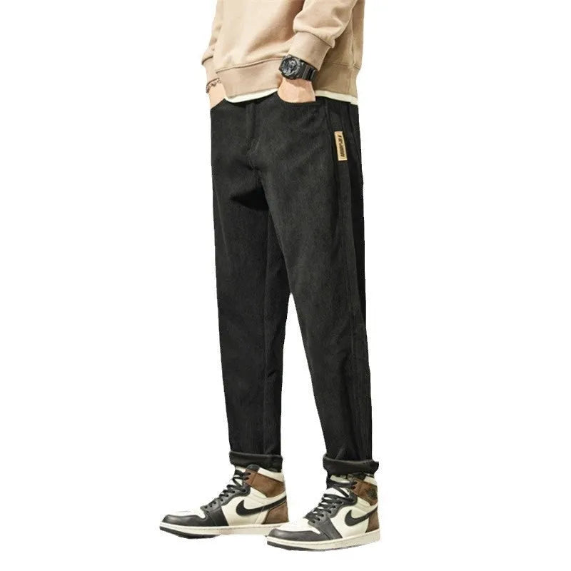 Men's straight-leg corduroy pants in army green colour with tapered fit and mid waist design