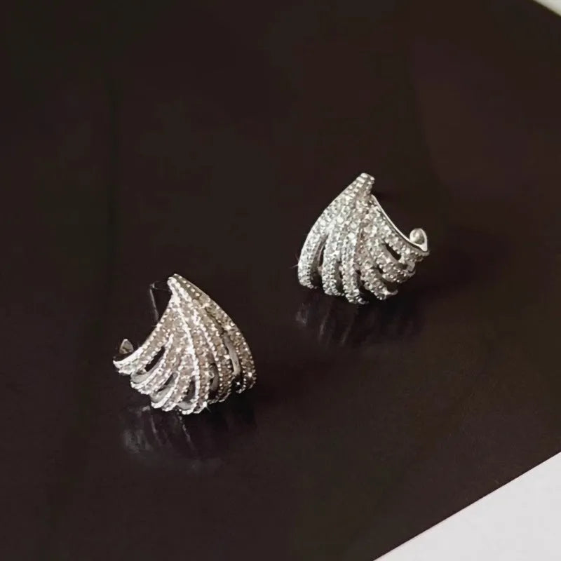 Geometric line design earrings with platinum electroplating on zircon, showing symmetrical patterns and clean architectural lines