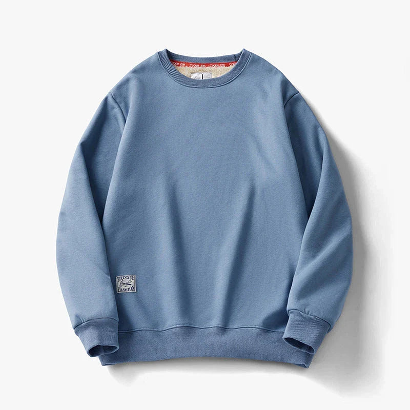 Cozy fleece pullover in a variety of classic colors, featuring a warm and soft fabric blend, stylish round neck design, and comfortable long sleeves.