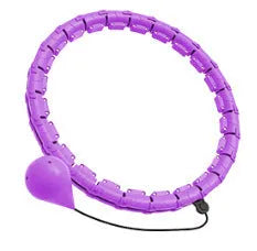 Pink massage soft ball with a detachable black belt, shown on a fitness mat.