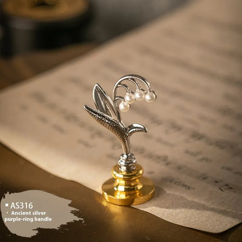 Wooden wax seal handle tool in various designs including lily, pearl cloud, and double dragon styles.
