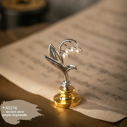 Wooden wax seal handle tool in various designs including lily, pearl cloud, and double dragon styles.