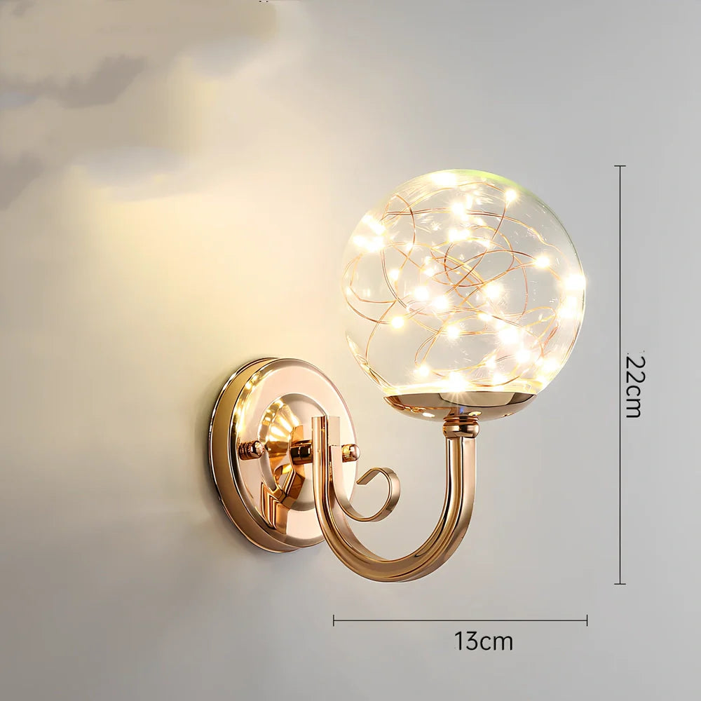 Crystal bedside lamp with stainless steel base and transparent shade providing soft illumination