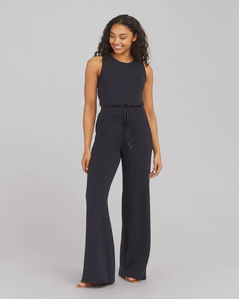 Women's lace-up jumpsuit pants in polyester, available in multiple colors and sizes for adjustable fit.