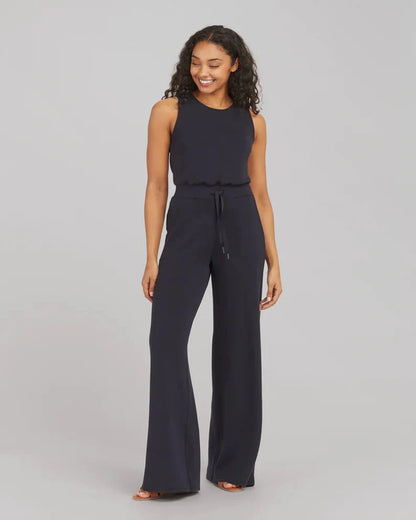 Women's lace-up jumpsuit pants in polyester, available in multiple colors and sizes for adjustable fit.