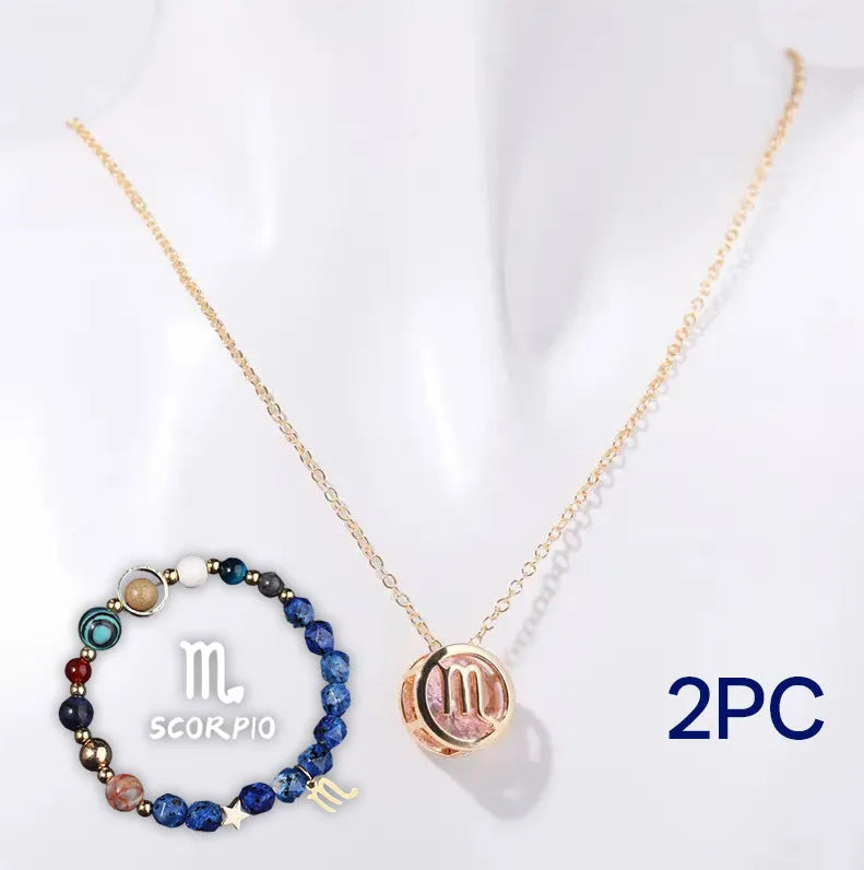 A natural stone beaded necklace and matching adjustable bracelet laid flat.