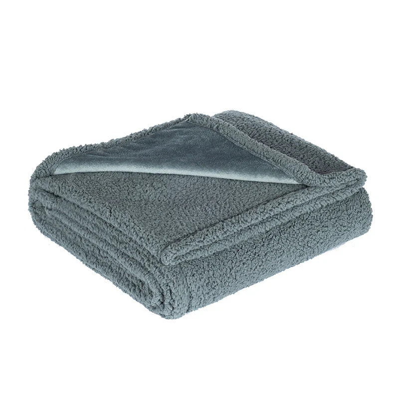 Cozy pet blanket made from soft flannel, wool, and sherpa in various colors and sizes