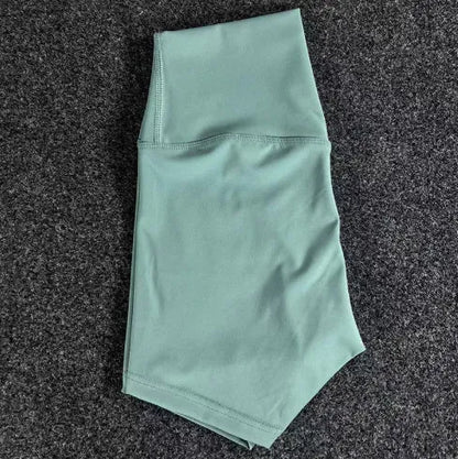 High-waisted yoga shorts in nylon fabric for moisture-wicking during sports, available in multiple colours and sizes.