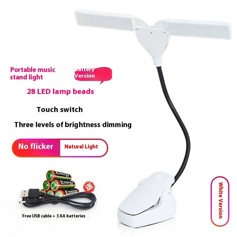 Black music stand light with flexible neck attached to metal music stand, illuminating sheet music