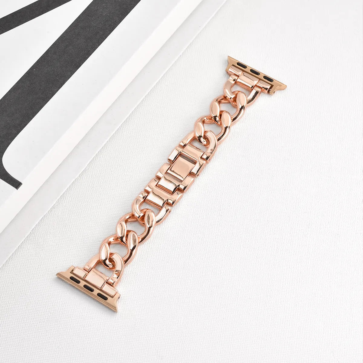 Silver metal link watch strap for Apple Watch with 22mm connectors on a grey background