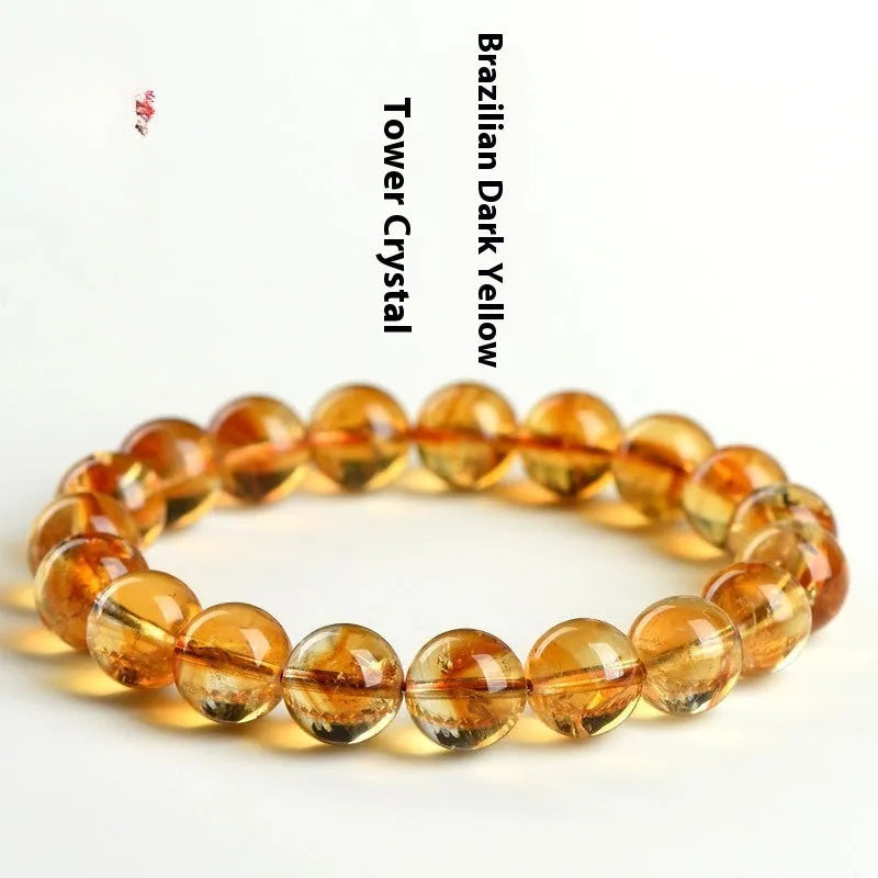 Natural yellow citrine bracelet with geometric beads in various sizes from 4mm to 20.8mm diameter on wrist