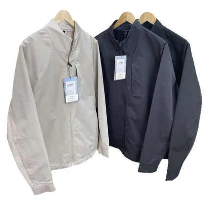 Men's stand collar casual jacket in polyester, shown in a neutral colour with straight hem and long sleeves.