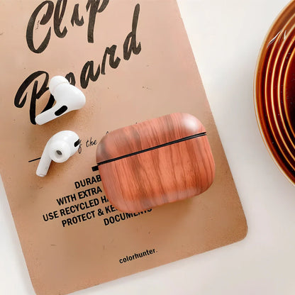 Wood grain AirPods case with IMD clamshell design showing six colour options including dark brown and red brown patterns