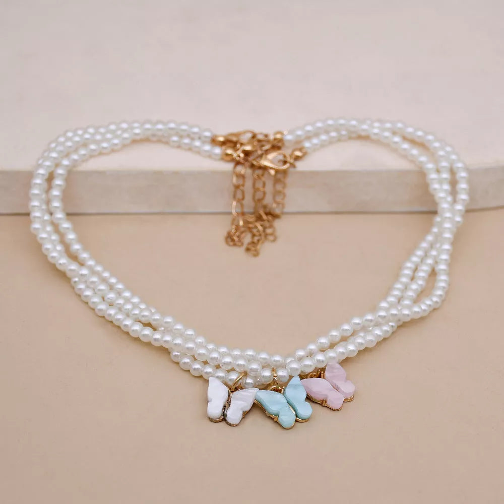 Elegant white pearl choker necklace with butterfly charm for women