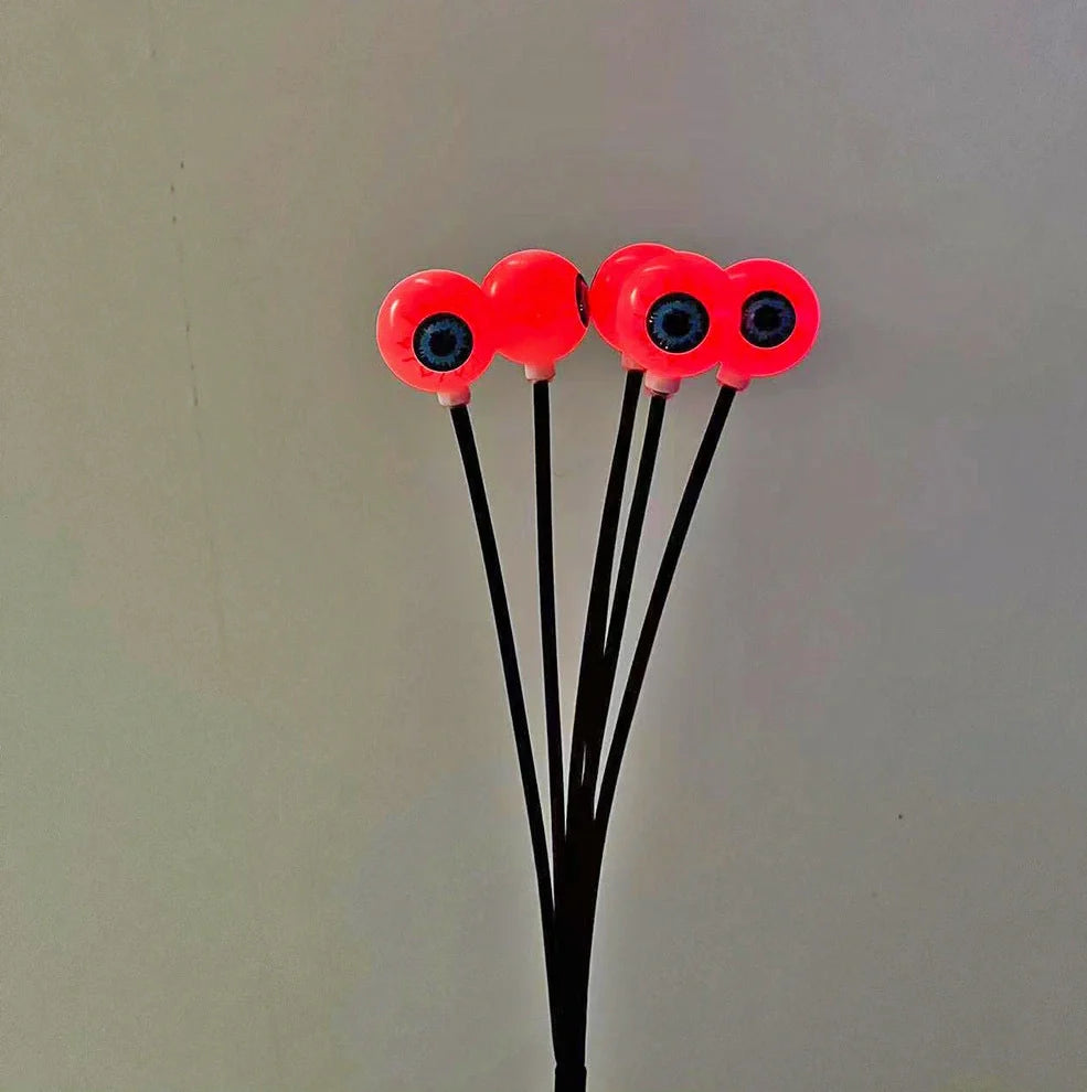Solar-powered Halloween string lights with detailed eyeball design for outdoor garden decoration