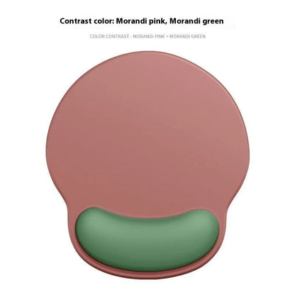 Silicone mouse mat with wristband in a gradient blue black colour pattern on a desk.