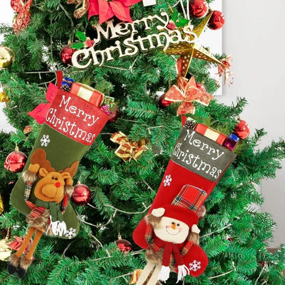 Set of three large red, white, and brown Christmas stockings with 3D Santa, Snowman, and Reindeer designs hanging on a tree.